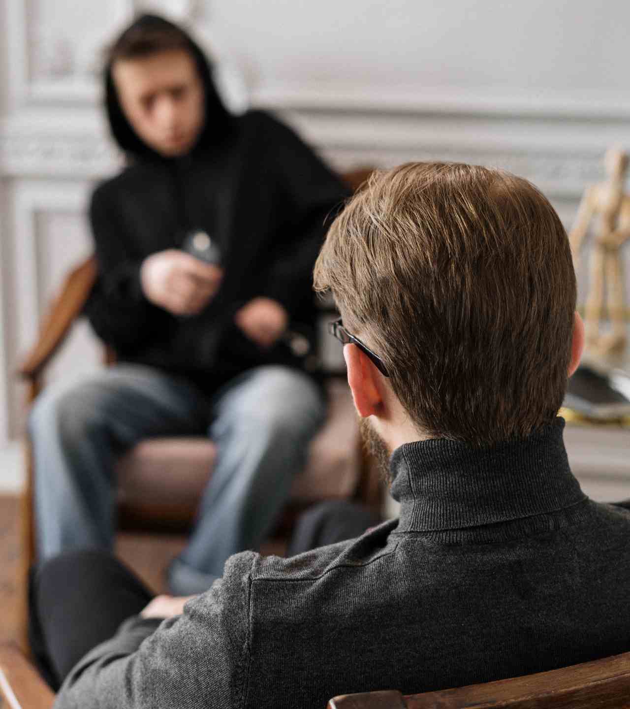 Young patient talking to therapist during marijuana abuse treatment program in Mississippi.