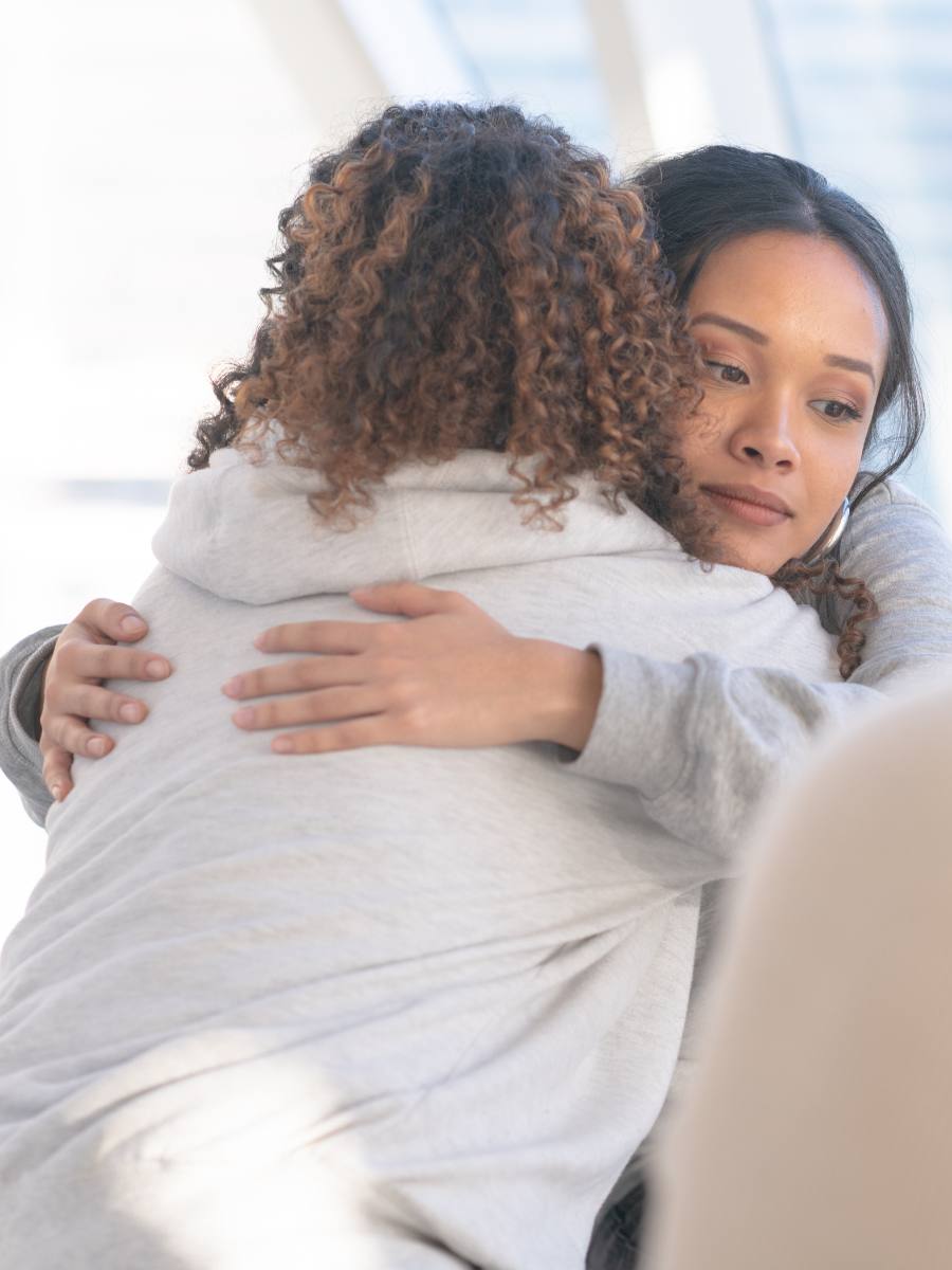 Woman comforting loved one and encouraging her to start Xanax addiction treatment in Mississippi. 