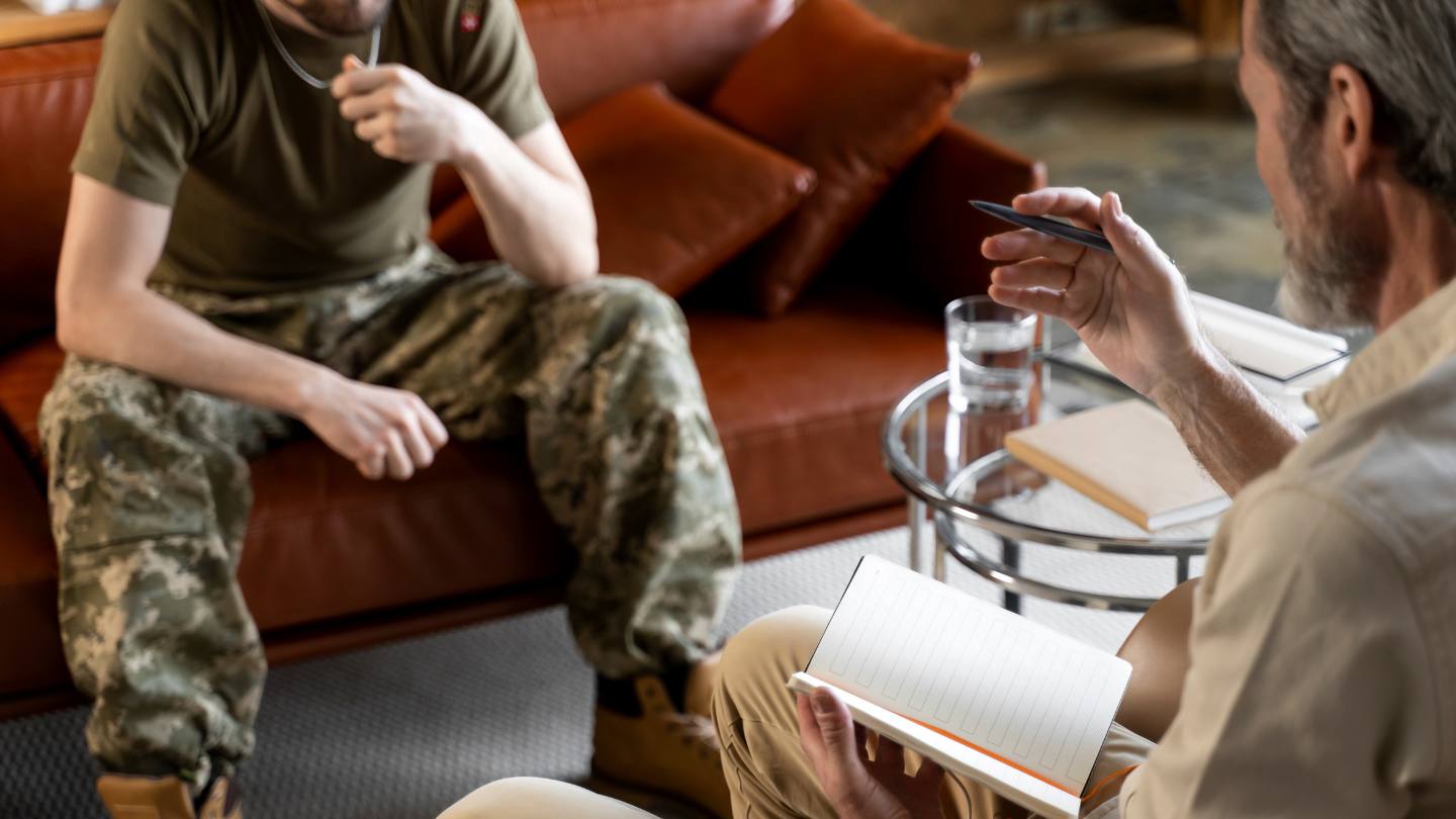 A profession talking to a client during an appointment at rehab for veterans in Mississippi. 