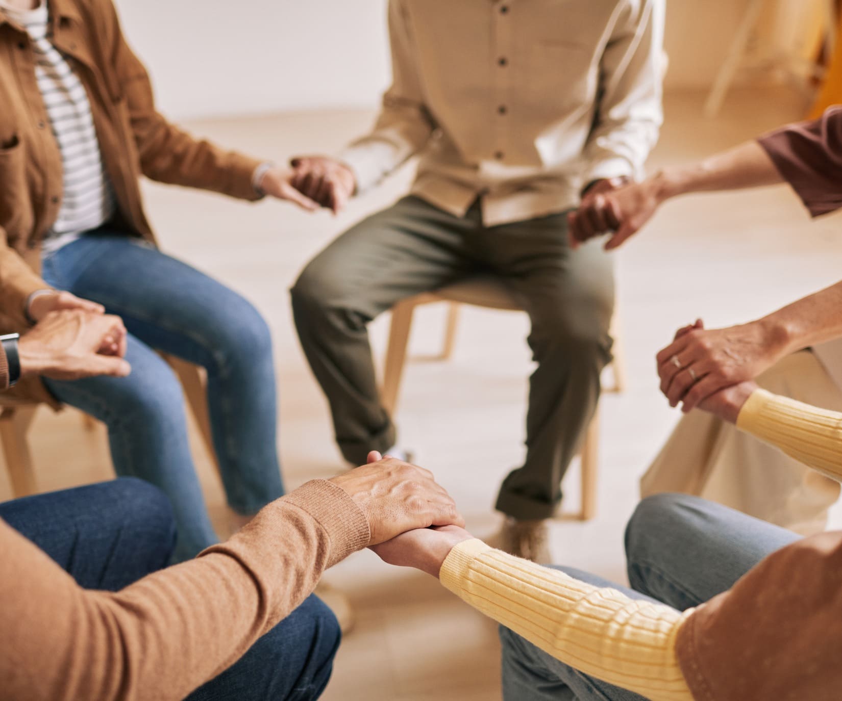 People supporting each other during a 12-Step rehab program in Mississippi.