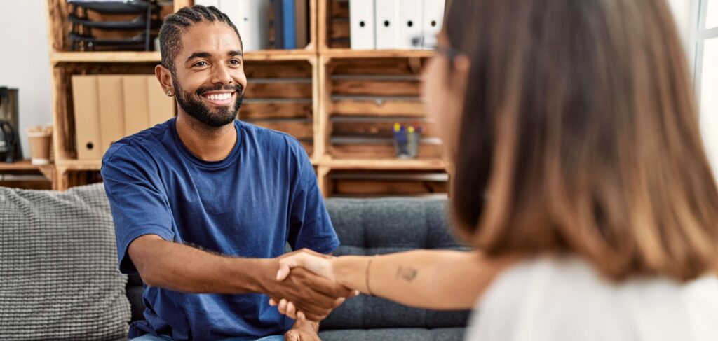 A man greets his therapist during depression treatment in Mississippi.