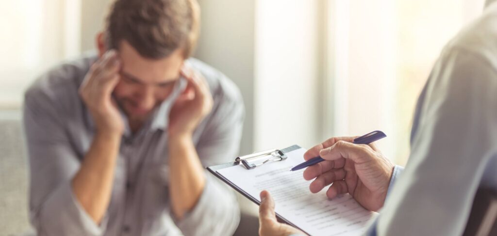 Man finds the answer to 'How long does drug withdrawal last?' during a consultation.