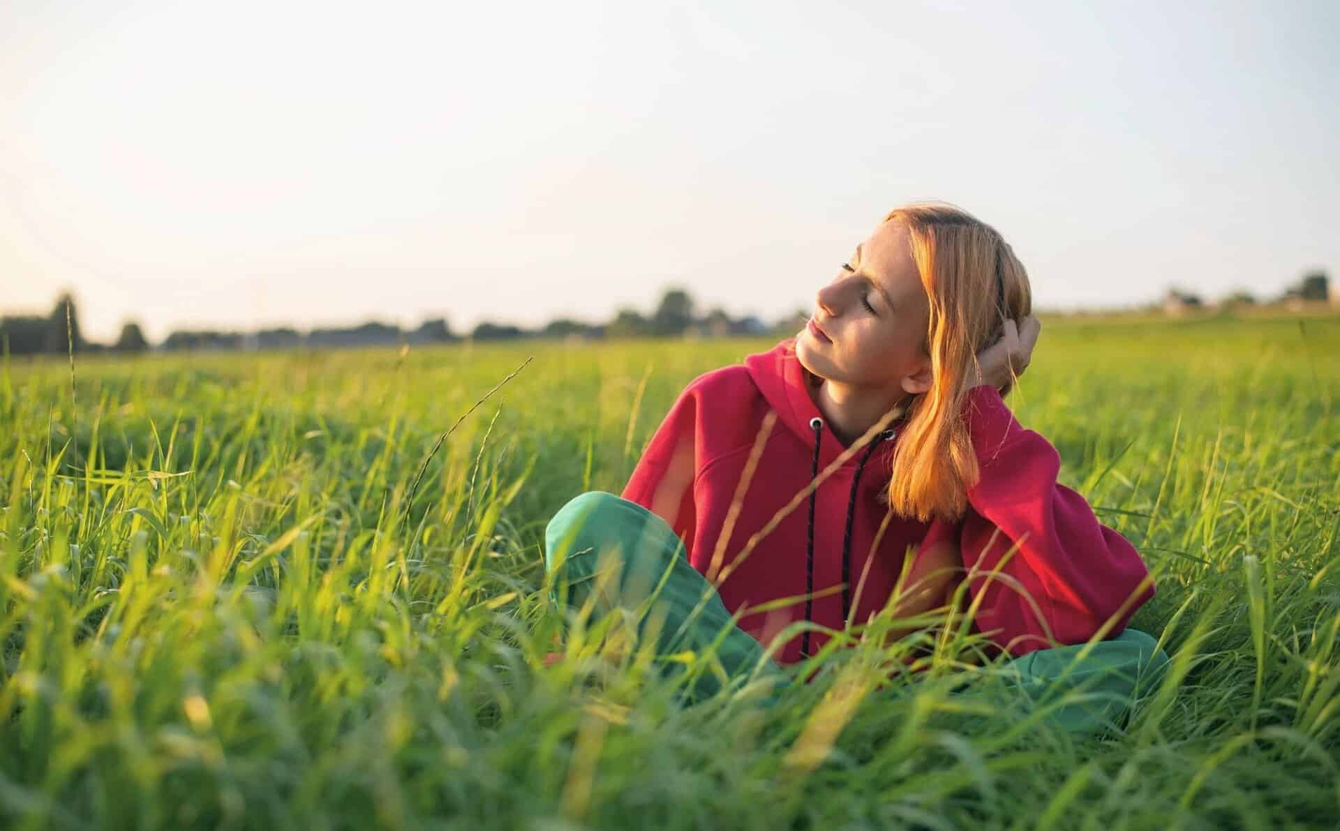 Sober woman feeling at peace after treatment for anxiety and addiction.