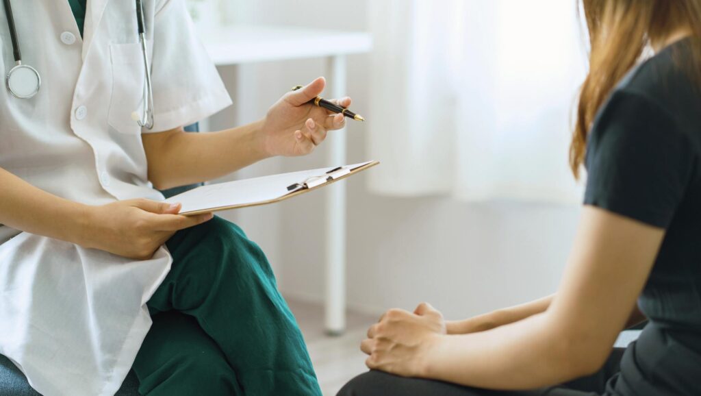 A professional guides a client through Oxycodone addiction treatment in Mississippi.