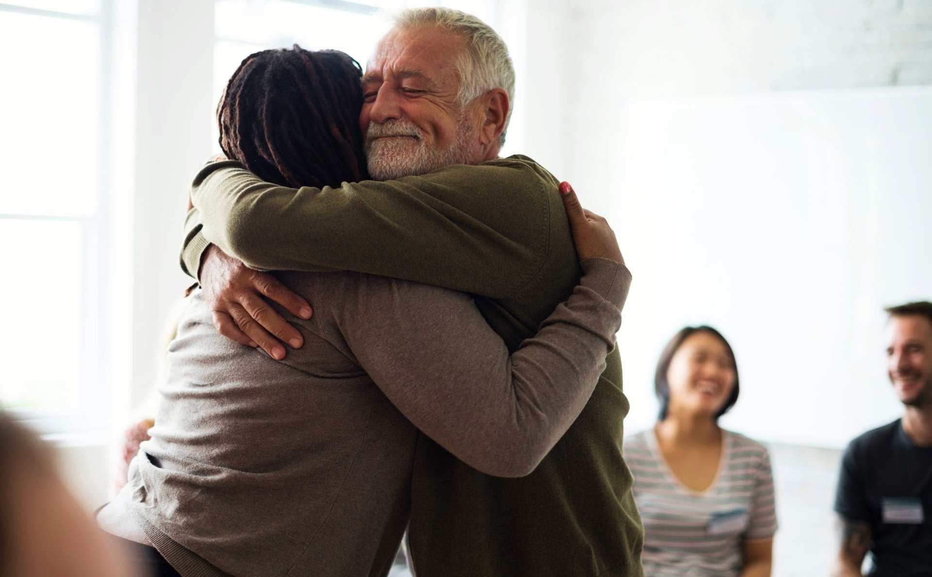 Man showing support after learning how to help a loved one with addiction.
