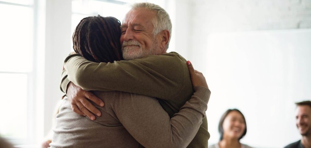 Man supporting loved one at chronic relapse treatment centers in Mississippi.
