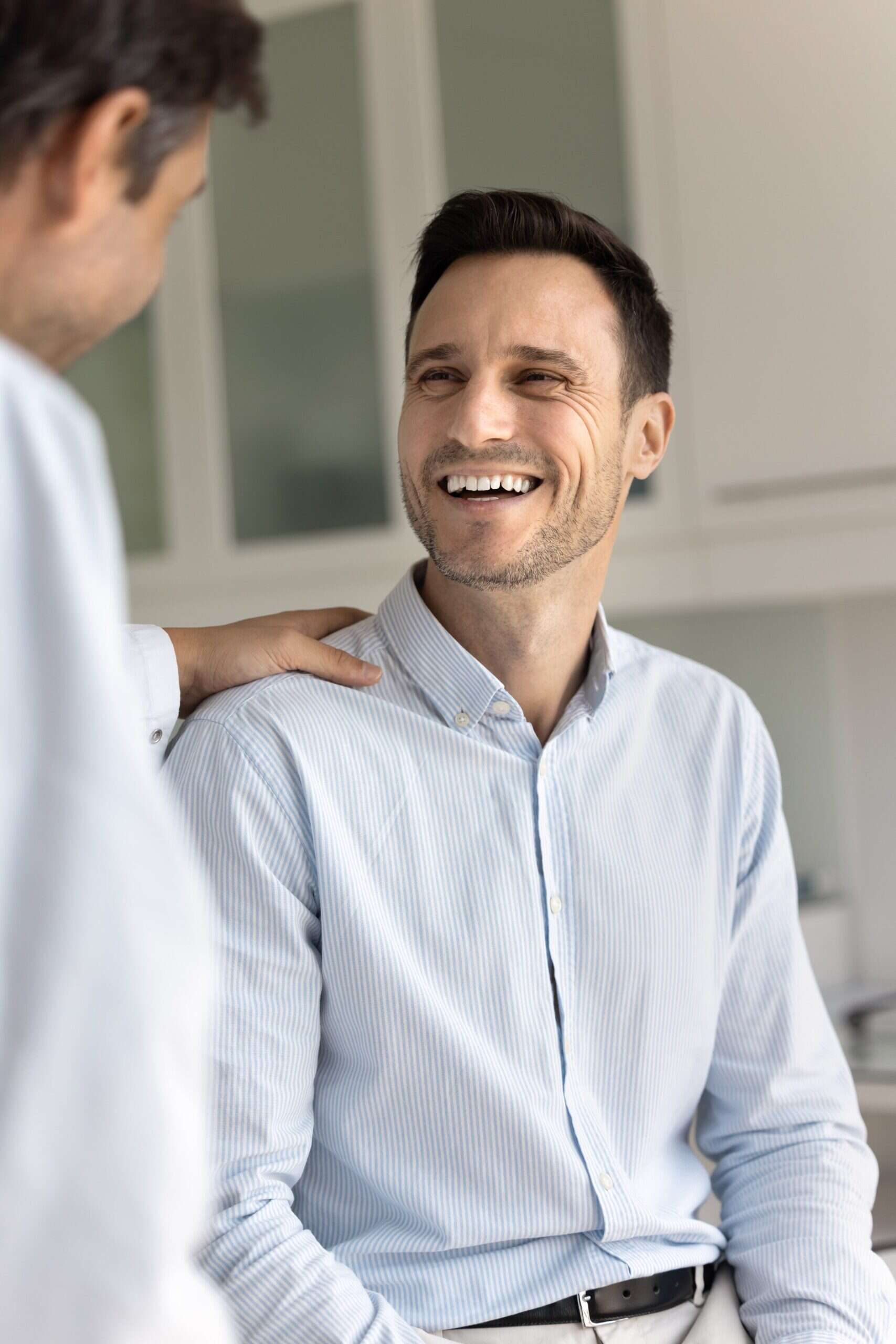 A man feels relief and talks to his doctor about aftercare after completing medication-assisted treatment in Mississippi.