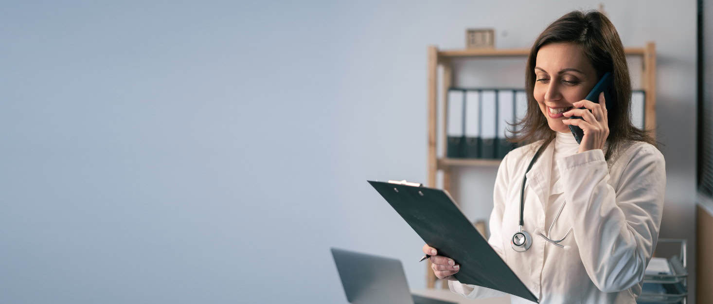 A doctor reviews insurance coverage through Aetna Rehab Coverage in Mississippi.