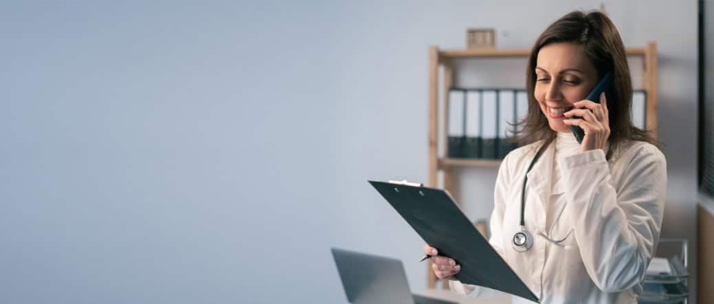 A doctor discusses Cigna drug rehab in Mississippi with a client over the phone.
