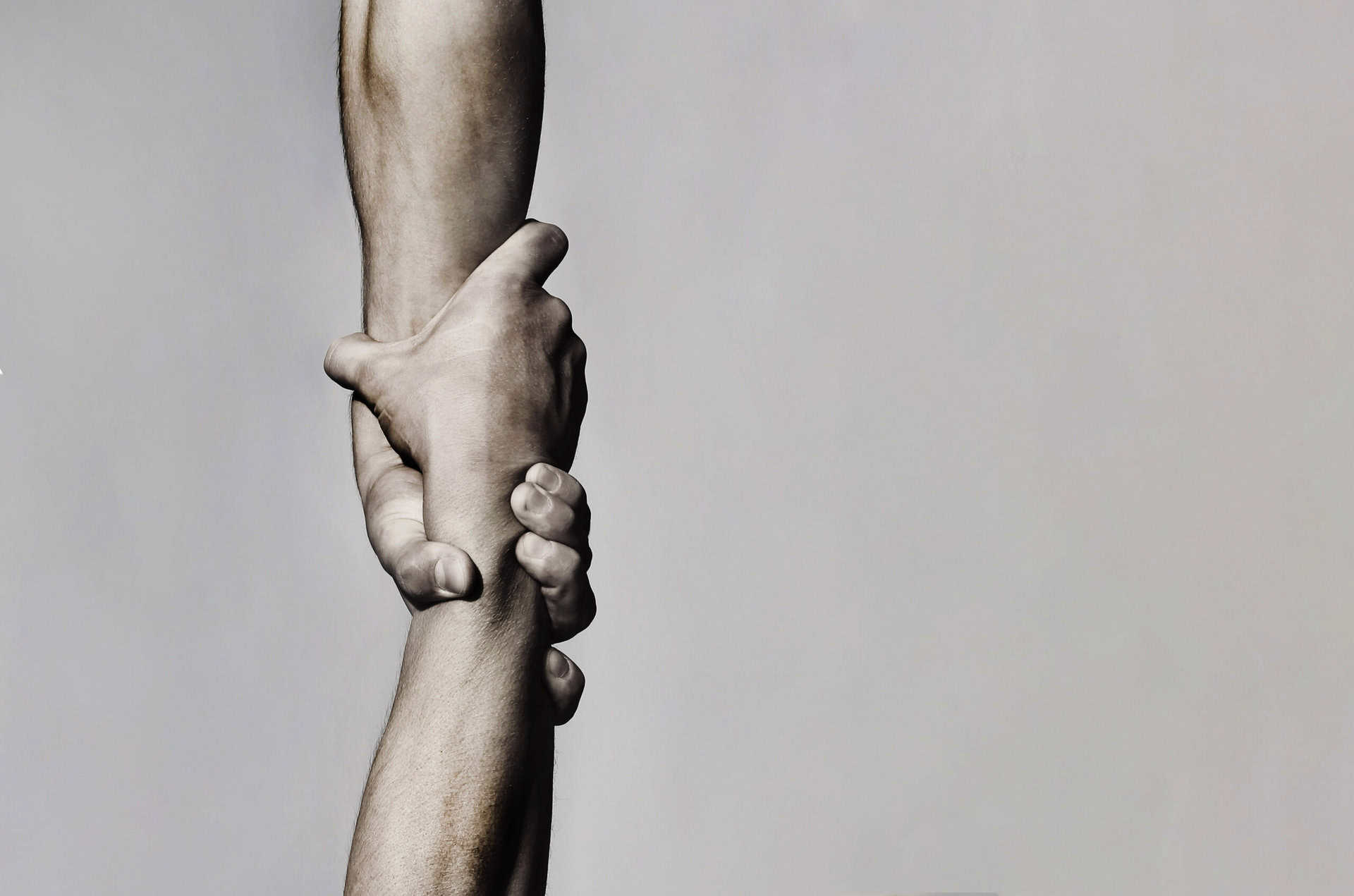 Hands symbolizing support and connection in unresolved trauma and addiction.