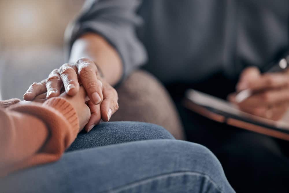 Therapist supporting patient during Ambien drug addiction treatment session